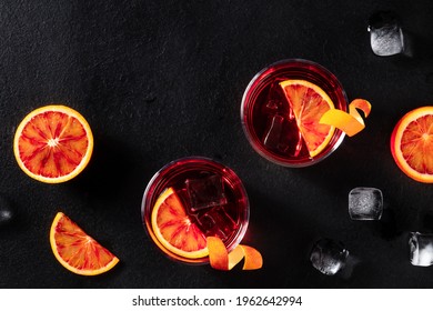 Negroni Cocktails With Blood Oranges And Ice, Shot From Above