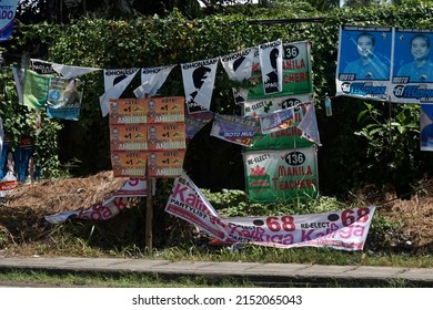 Negros Oriental, Philippines; April 29, 2022: Election posters of different candidates and party-list organizations, cluttering the roadside in Dumaguete City.
