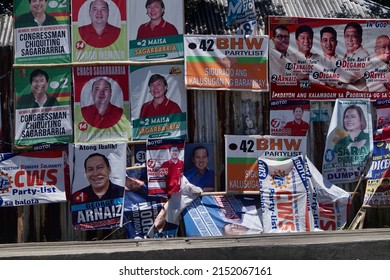 Negros Oriental, Philippines; April 29, 2022: Election posters of different candidates and party-list organizations cluttering the roadside in Dumaguete City.