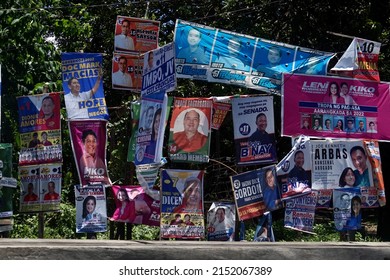 Negros Oriental, Philippines; April 29, 2022: Election posters of different candidates and party-list organizations cluttering the roadside in Dumaguete City.