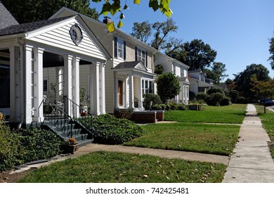 Neighborhood City Block Of Homes With Blue Sky.