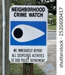 Neighborhood crime watch sign with a shallow depth of field