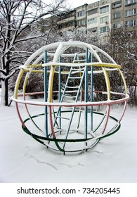 Neighborhood Jungle Gym,children Playground In Front Of A Building,winter Time,close Up