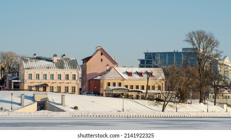 Neighborhood Of Old Houses And Modern Buildings In Winter. Retro Versus Modern Style. Contrast In Architecture. Cityscape Background.