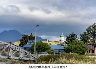 Neighborhood View in Dutch Harbor Unalaska Alaska with a Bald Eagle on top of the Light Pole