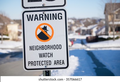 Neighborhood Watch Sign In A Snowy Midwest Suburb.