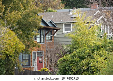 Neighborhood Wood Shingle House With Red Door 