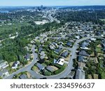 Neighborhoods blanket the hills around Bellevue, WA.