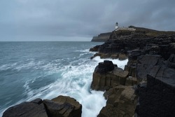 Neist Point Lighthouse Rocky Coastline, Isle Of Skye, Scotland