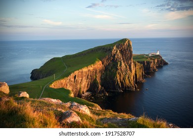 Neist Point Lighthouse at sunset, Isle of Skye, Scotland.	