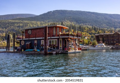 Nelson, British Columbia, Canada - September 25, 2021: Houseboat In A Marina During A Sunny Morning.