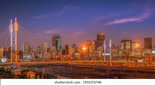 Nelson Mandela Bridge And Johannesburg City Lit Up At Night