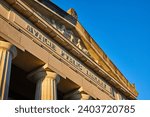 Neoclassical Muncie Public Library Facade at Sunrise with Blue Sky