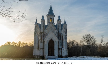 Neo-Gothic style chapel on sunset sky background. Religious concepts. Space for text.