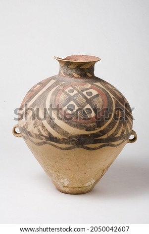 Neolithic earthenware vase with various patterns. Asian antique.