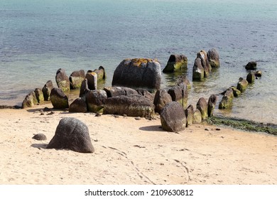 Neolithic tomb - dolmen or gallery grave also passage grave - of Guinirvit, ruins in the sea, Bay of Kernic, Plouescat, Finistere, Brittany, France