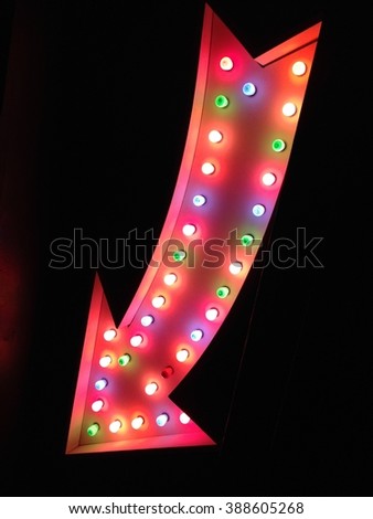 neon arrow way point sign lights fairground carnival circus vintage style vegas bulb pointing at night red with light bulbs stock, photo, photograph, picture, image