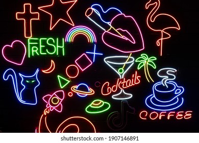 Neon assorted shapes on a black wall. Glowing multi-colored neon. - Powered by Shutterstock