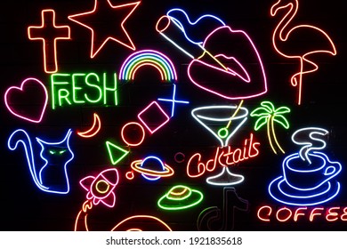 Neon assorted shapes on a black wall. Glowing multi-colored neon. - Powered by Shutterstock