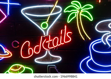 Neon assorted shapes on a black wall. Glowing multi-colored neon. - Powered by Shutterstock