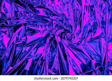 Neon background foil with purple and blue light. Psychedelic abstract gradient texture. Crazy wallpaper.