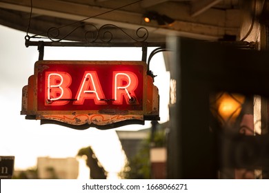 Neon bar sign hangs along Bourbon Street in the French quarter of New Orleans Louisiana USA in the French quarter of New Orleans Louisiana USA