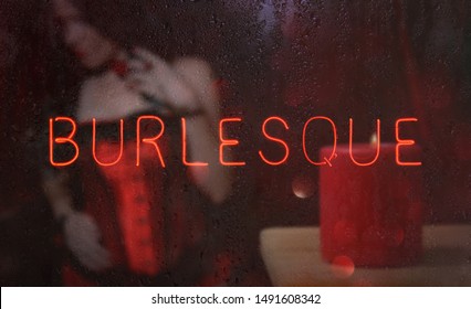 Neon Burlesque Sign in Wet Window
