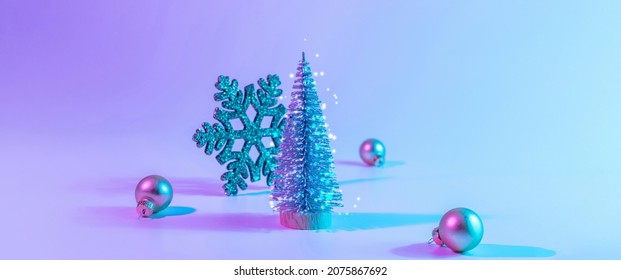 Neon Christmas winter background  Minimal abstract tree  xmas gift box  Holiday decoration bauble ball neon gradient backdrop  Happy new year copy space