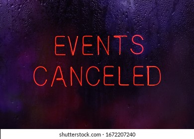 Neon Events Canceled Sign in Rainy Window