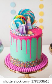 Neon Green And Pink Drip Happy Birthday Cake By Katherine Sabbath Topped With Assorted Rainbow Coloured Lollipop Swirls And Candy Shards