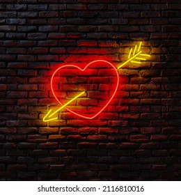 Neon heart and arrow hanging on old brick wall. Extra space to add a text. - Powered by Shutterstock