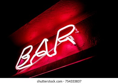 Neon Inscription BAR On The Wall. Neon Inscription BAR In Different Colors. Multicolored Neon Inscription BAR On Dark Background