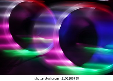 Neon light pattern. Abstract circles isolated on a black background. Luminous pattern, modern minimalistic concept. Copy space. High quality photo