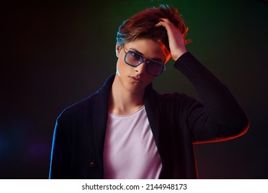 Neon Light Portrait Of Handsome Male Model With Dark Medium Length Hair, Hairstyle, Wear Sunglasses.