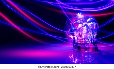 Neon Light Skull On A Dark Background. Halloween Background. Futuristic Light Lines, Bokeh.