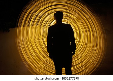 Neon Light Slow Shutter Speed ​​ With A Man Standing In The Middle