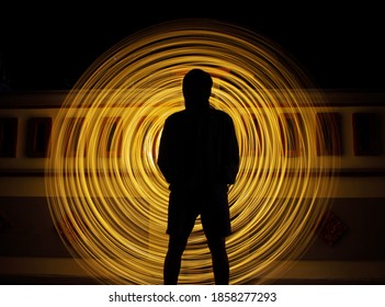 Neon Light Slow Shutter Speed ​​ With A Man Standing In The Middle