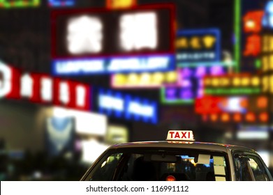 Neon Light And Taxi In Hong Kong City