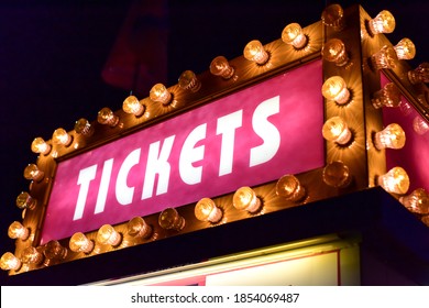 Neon Lights Of Amusement Park Ticket Booth Sign At Night