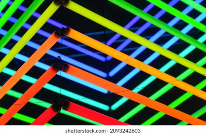 Neon Lights As A Background. Installation Of Neon Lines For The Design. An Art Installation Of Colored Lights. Photo In High Resolution.