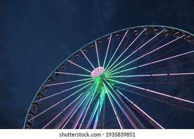 Neon Lights On Ferris Wheel At Night In Seattle, Washington