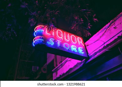 Neon Liquor Store Sign At Night