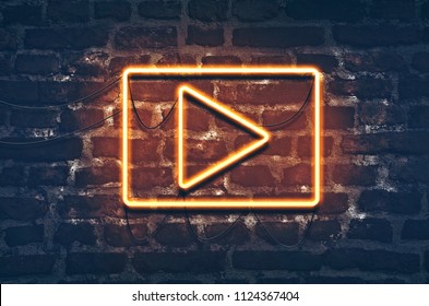 Neon music play sign on dark brick wall background - Powered by Shutterstock