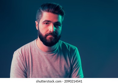 Neon Portrait Of A Young Attractive Man In The Studio. Close-up