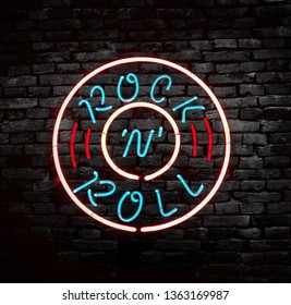 Neon Rock N Roll Sign On Brick Wall