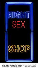 Neon Sex Shop Sign In A Window