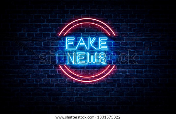 A neon sign in blue and red light on a\
brick wall background that reads: FAKE\
NEWS