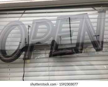 Neon ‘open’ Sign In A Business Window Is Not Turned On