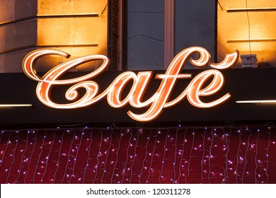 Neon sign of French cafe at christmas time, Paris, France - Powered by Shutterstock