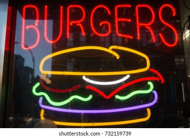 Neon Sign Of A Hamburger In A Restaurant Window